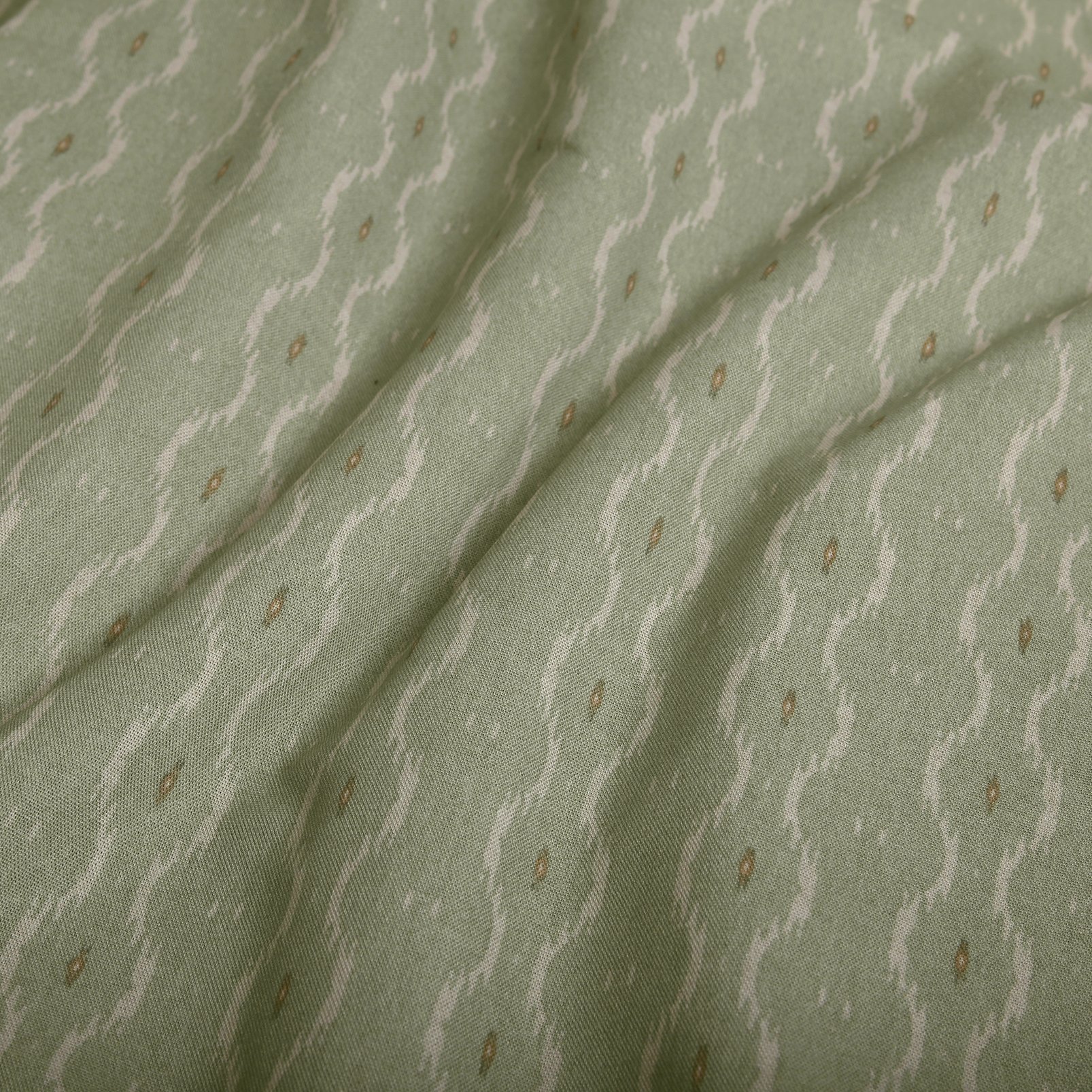 Rustic Ikat Sage Light Filtering Roller Blind fabric close up image